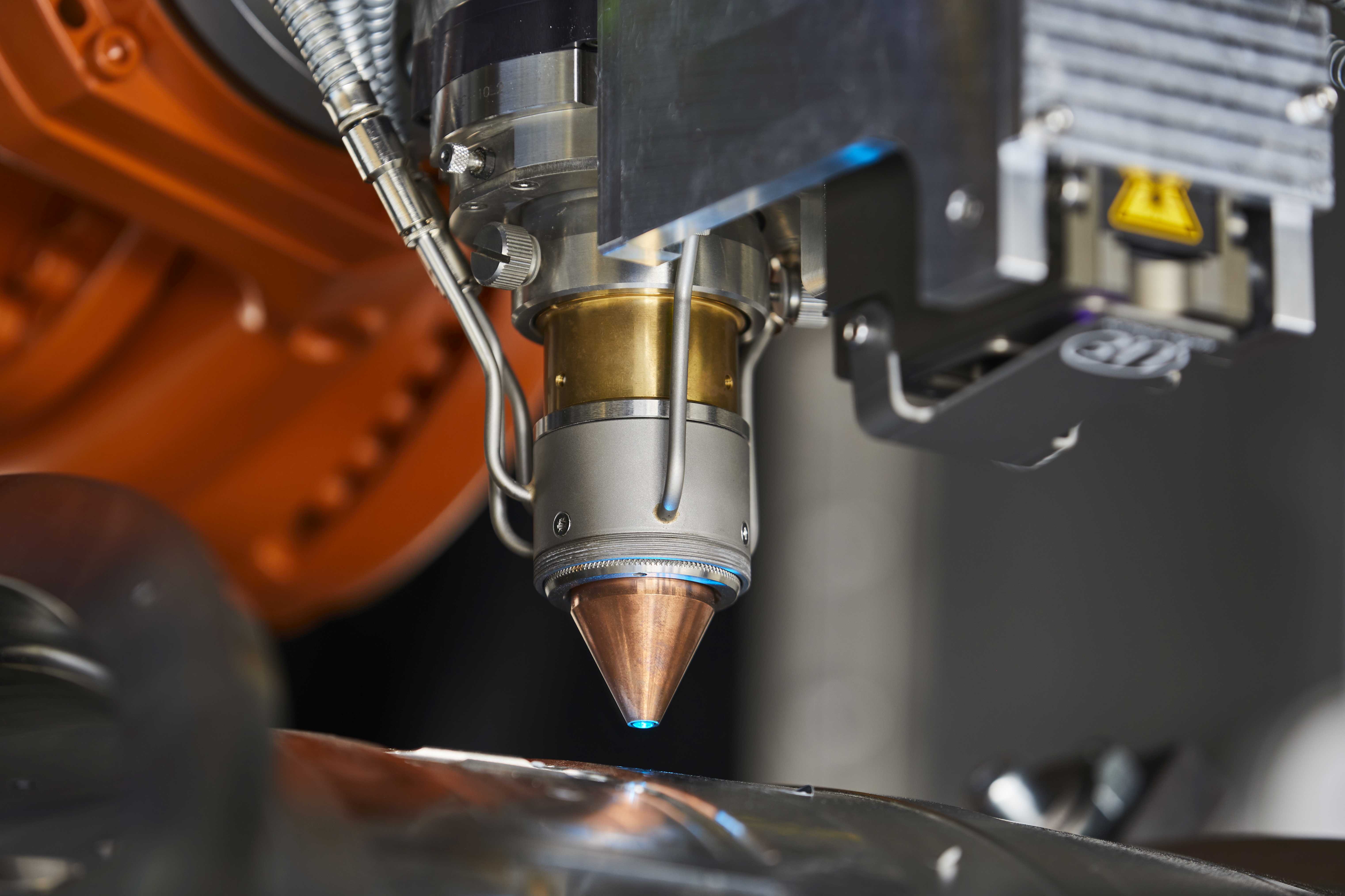 Up close: Nozzle of the Fraunhofer ILT for Laser Material Deposition in the protective gas cell of the ProLMD system at project partner KUKA in Würselen/Germany. 